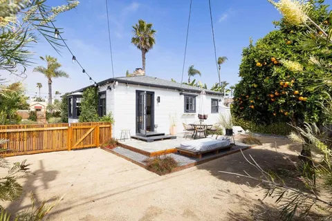 a view of a backyard with sitting area