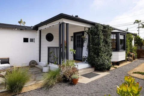 a front view of a house with garden
