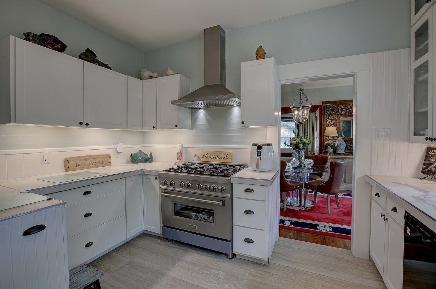 1903 South Austin Avenue Georgetown, TX 78626 - Photo 22 of 40 Clean lines, and commercial grade Z-line appliances. 6 burner gas stove, with downdraft. Zline Exhaust fan, and under counter Z-line microwave make this kitchen sleek and functional!