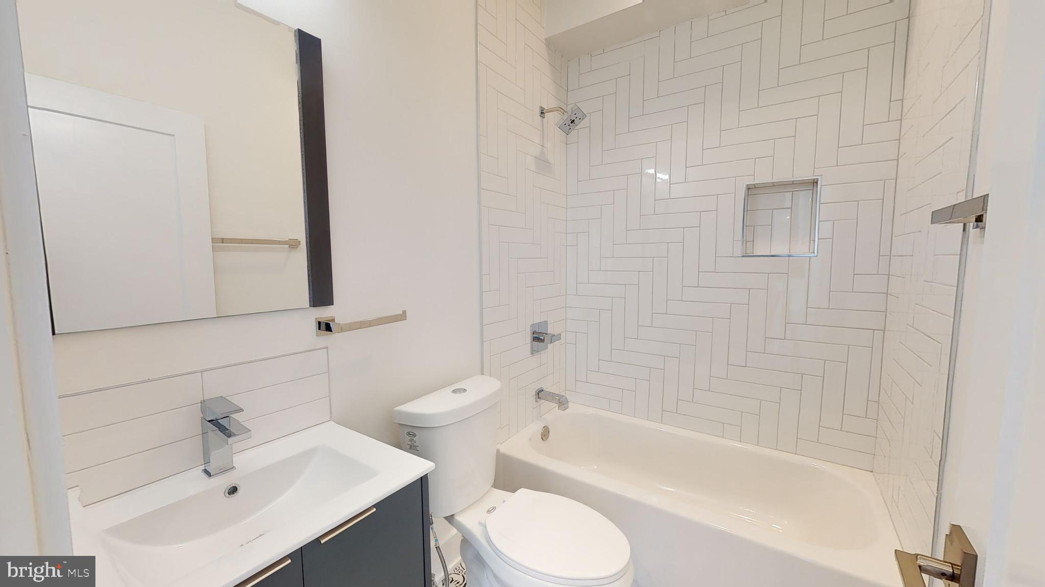 812 North 16th Street, Unit 3 Philadelphia, PA 19130 - Photo 5 of 17 a bathroom with a sink toilet and shower