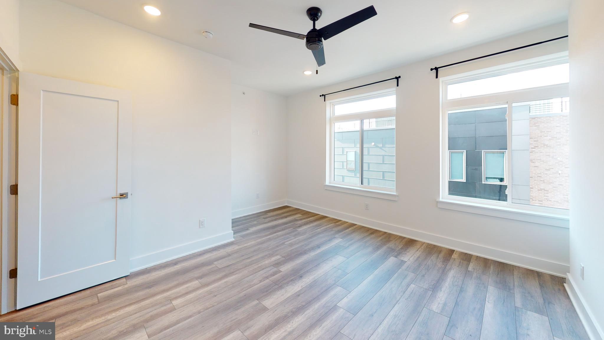 812 North 16th Street, Unit 3 Philadelphia, PA 19130 - Photo 6 of 17 a view of empty room with wooden floor and fan