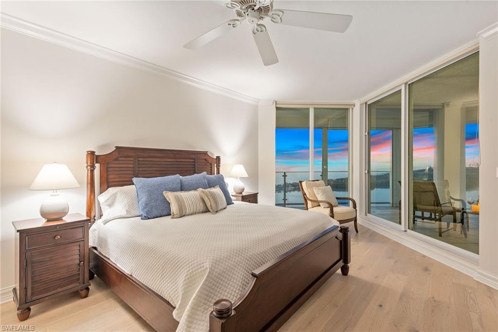 60 Seagate Drive, Unit 1606 Naples, FL 34103 - Photo 13 of 44 a bedroom with double bed and a window