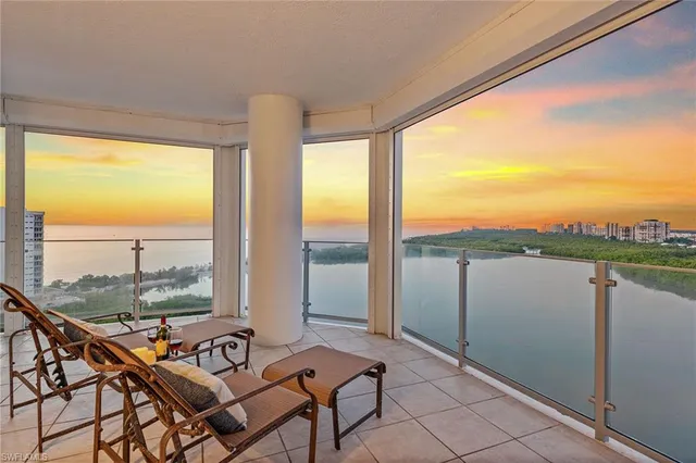 a outdoor space with a large window and furniture