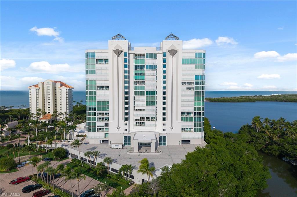 60 Seagate Drive, Unit 1606 Naples, FL 34103 - Photo 32 of 44 a view of building with outdoor space and lake view