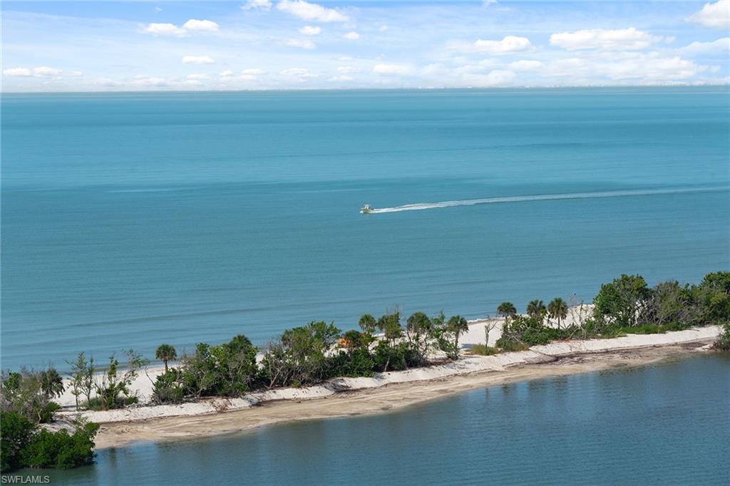 60 Seagate Drive, Unit 1606 Naples, FL 34103 - Photo 37 of 44 a view of a lake with a room