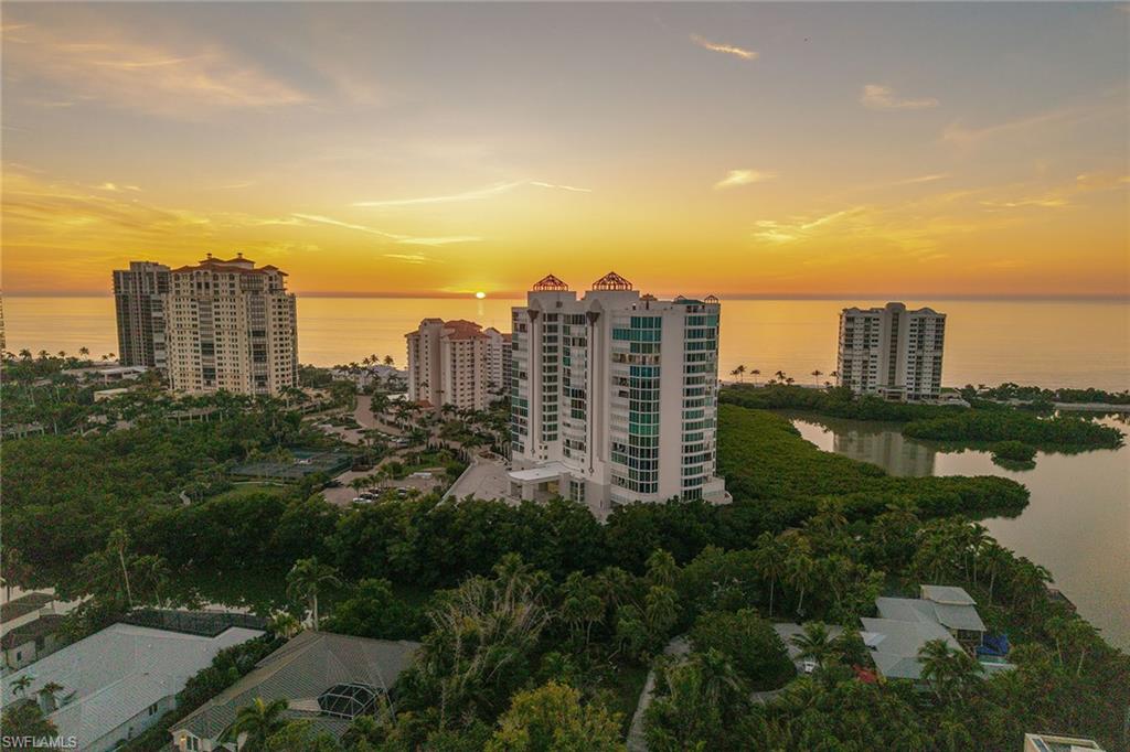60 Seagate Drive, Unit 1606 Naples, FL 34103 - Photo 42 of 44 a view of a city with tall buildings and a big yard