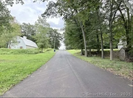 a view of a street with a park