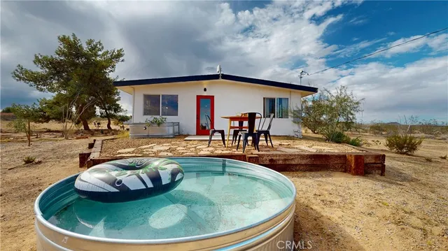 a view of a house with swimming pool