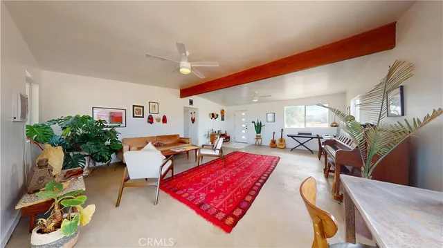 a living room with furniture fireplace and rug