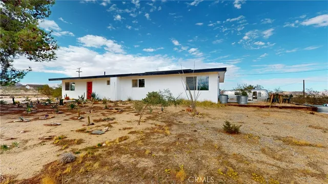 a view of a house with roof yard