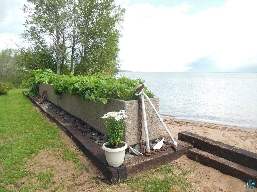 6431 Summit Avenue Washburn, WI 54891 - Photo 14 of 25 View of yard featuring a vegetable garden and a water view
