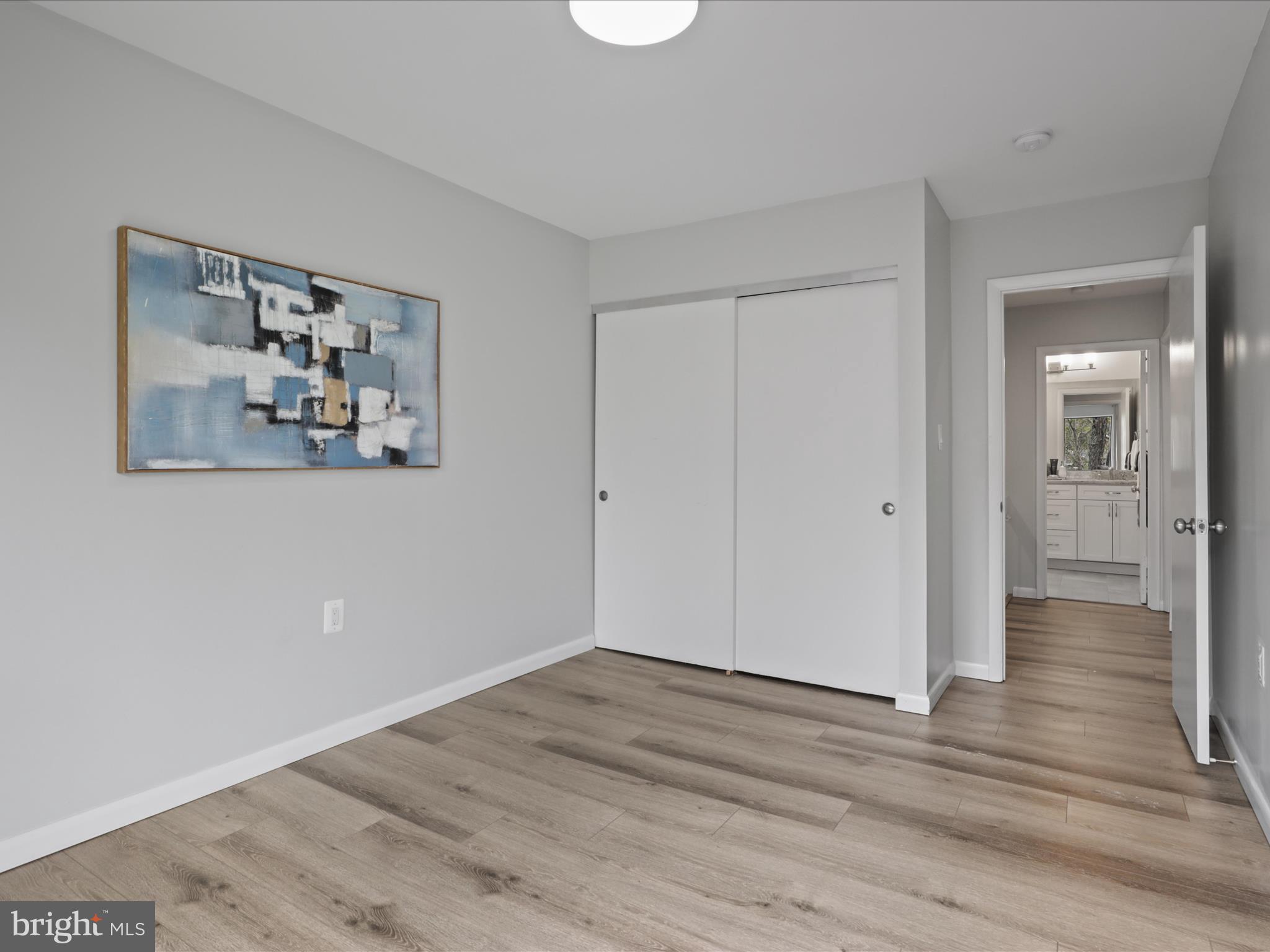 11159 Saffold Way Reston, VA 20190 - Photo 18 of 51 a view of a hallway with wooden floor