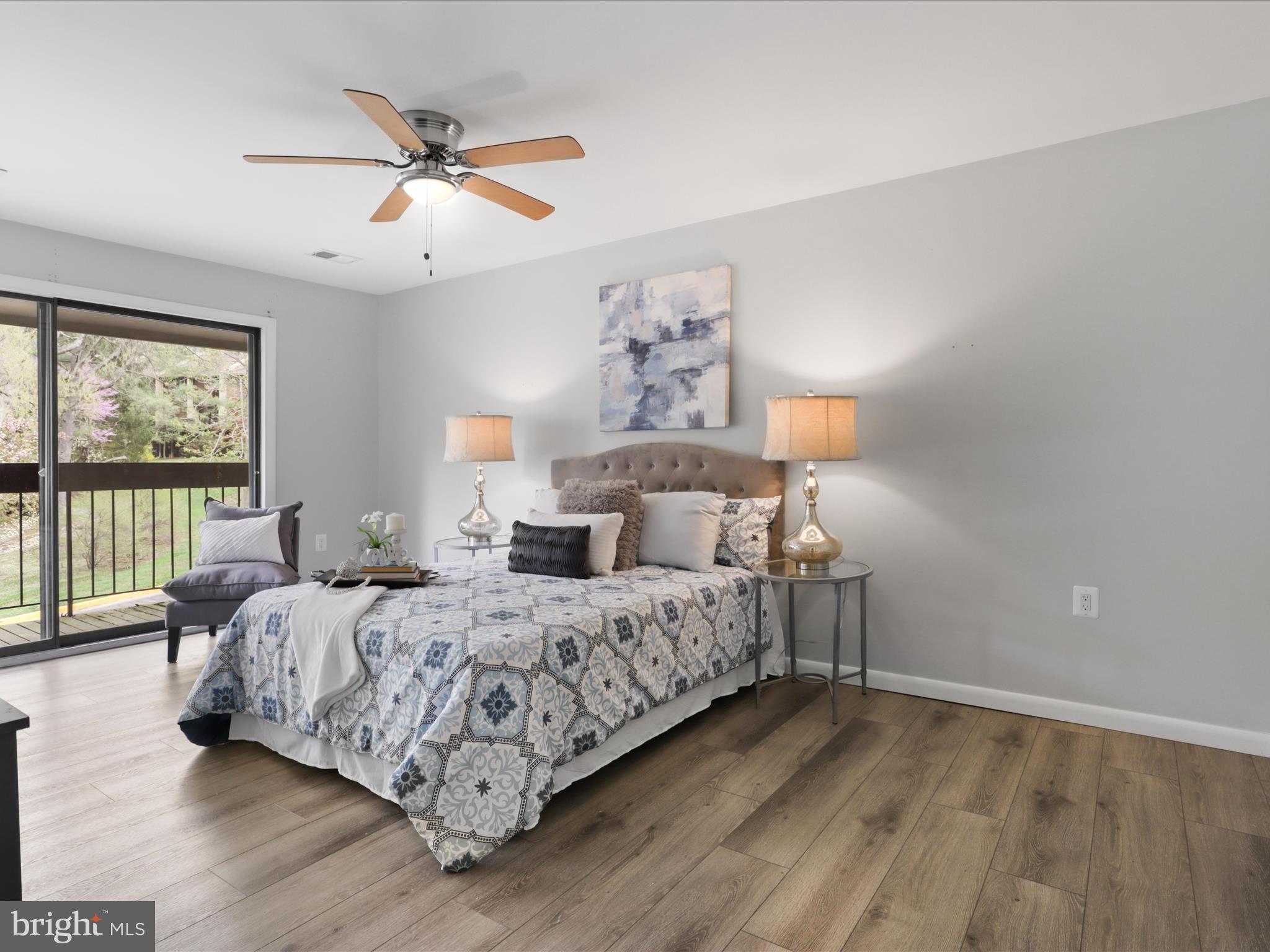 11159 Saffold Way Reston, VA 20190 - Photo 20 of 51 a bedroom with bed and window