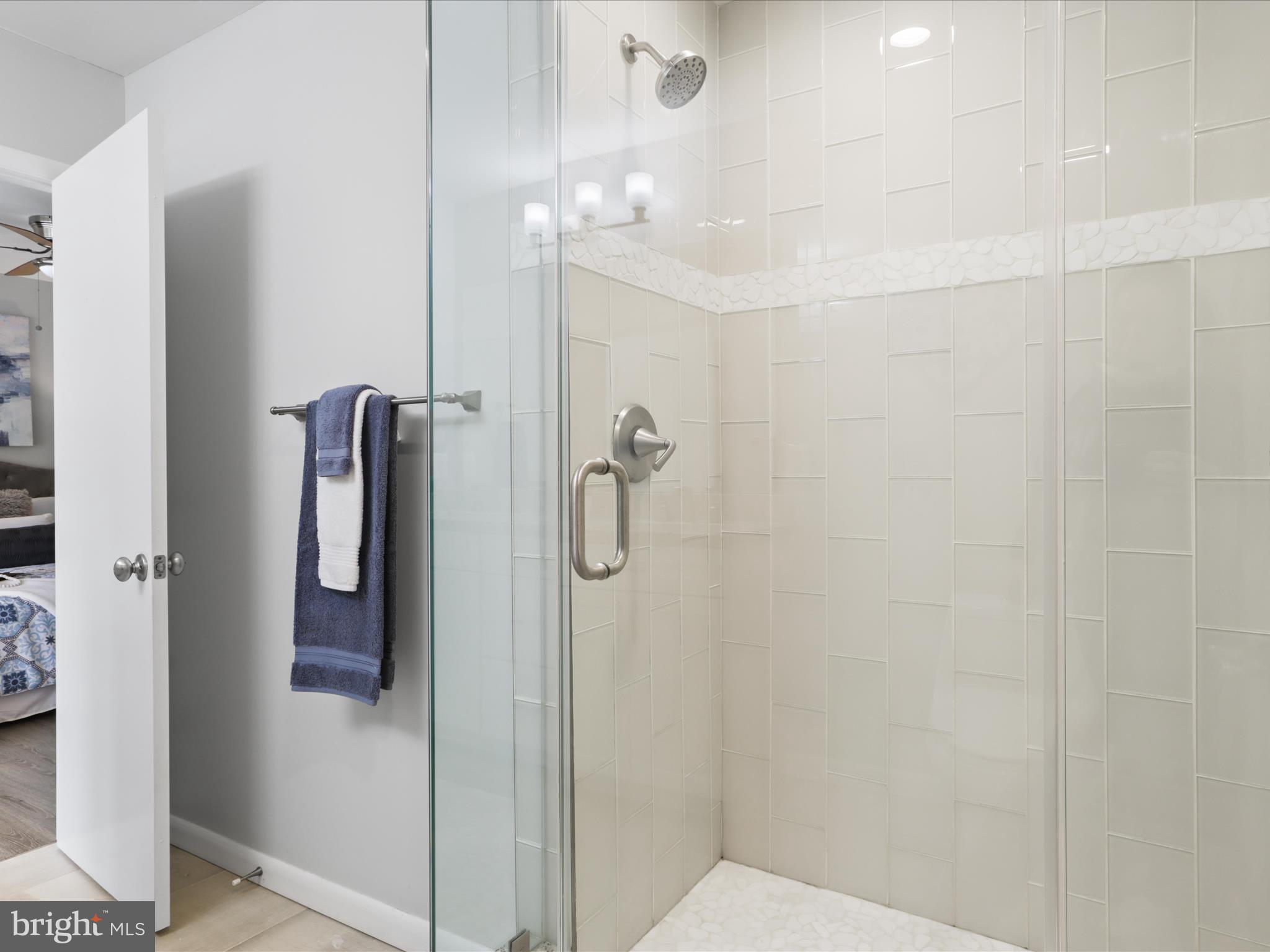 11159 Saffold Way Reston, VA 20190 - Photo 24 of 51 a bathroom with a shower