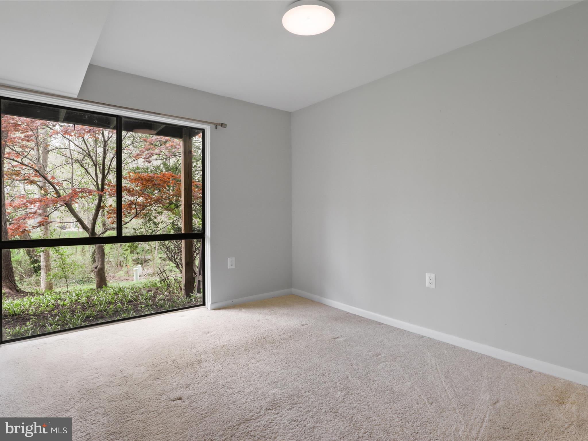 11159 Saffold Way Reston, VA 20190 - Photo 28 of 51 an empty room with large windows