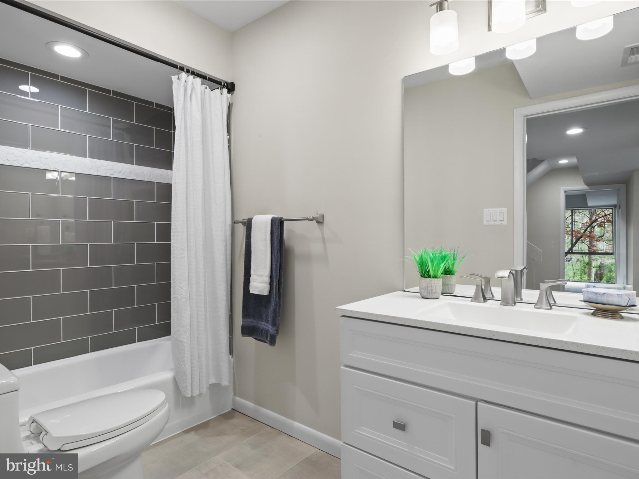 11159 Saffold Way Reston, VA 20190 - Photo 30 of 51 a bathroom with a bathtub sink and toilet
