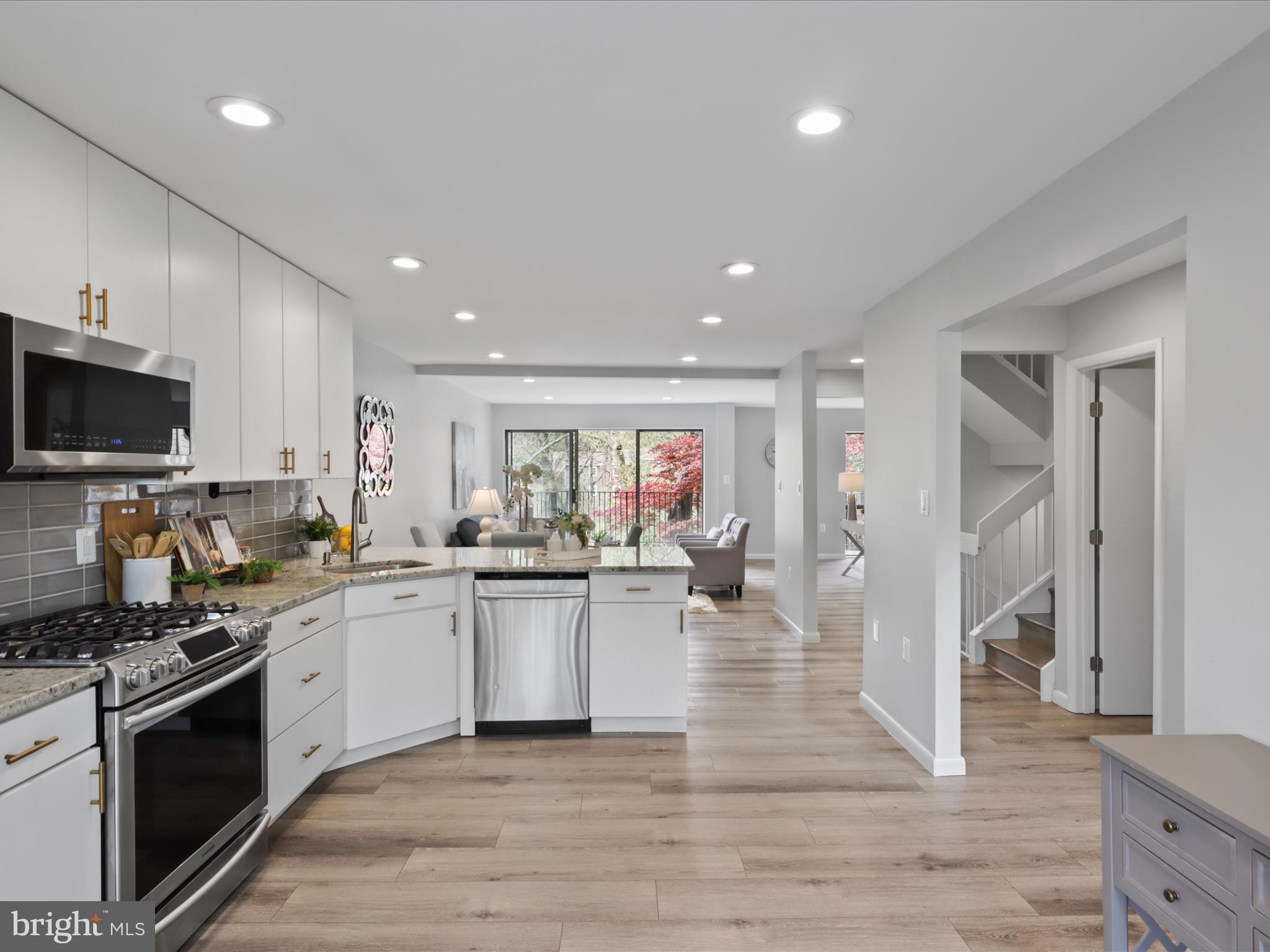 11159 Saffold Way Reston, VA 20190 - Photo 3 of 51 a kitchen with a sink stainless steel appliances and cabinets