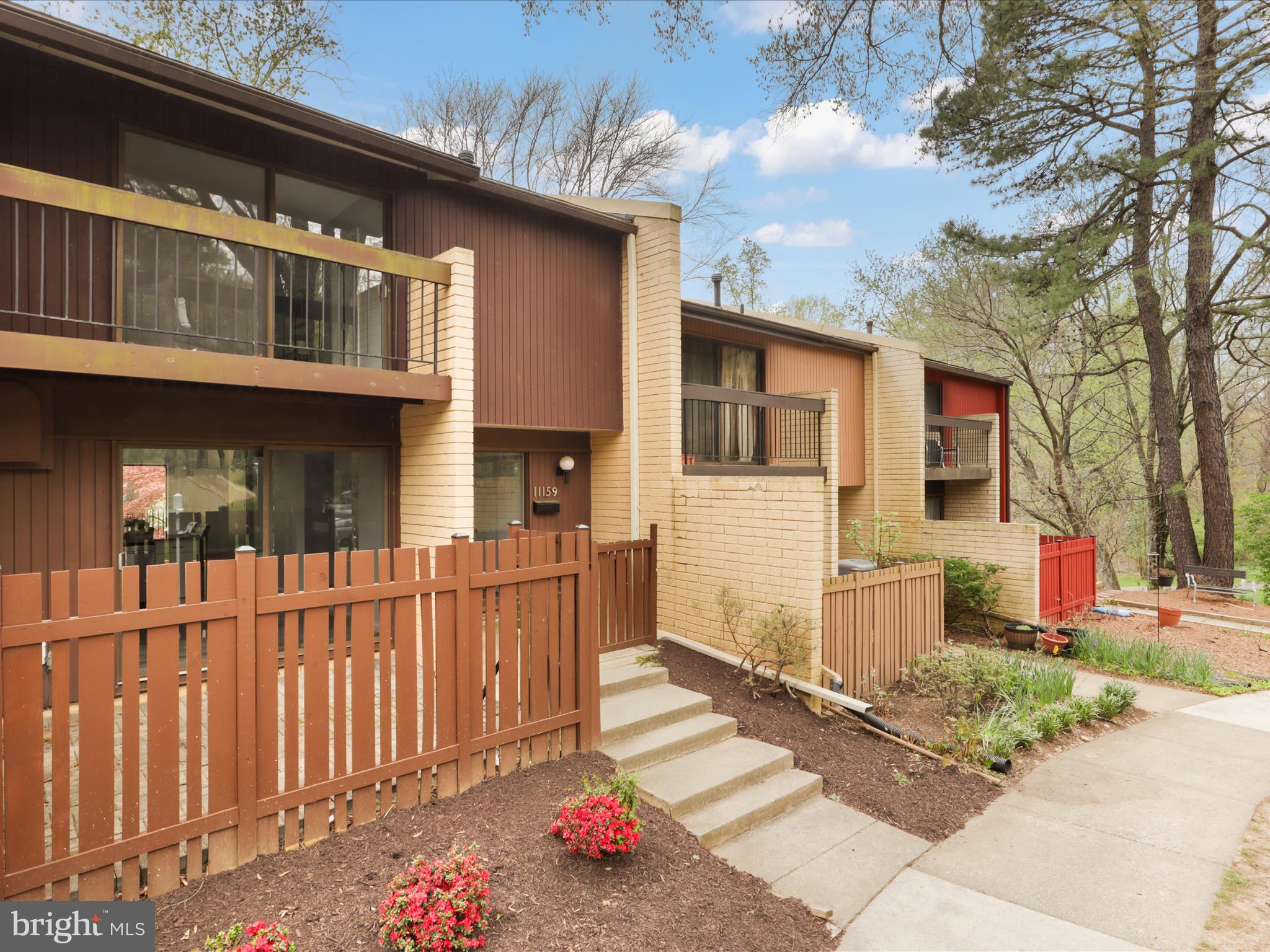11159 Saffold Way Reston, VA 20190 - Photo 36 of 51 a front view of a house with a porch