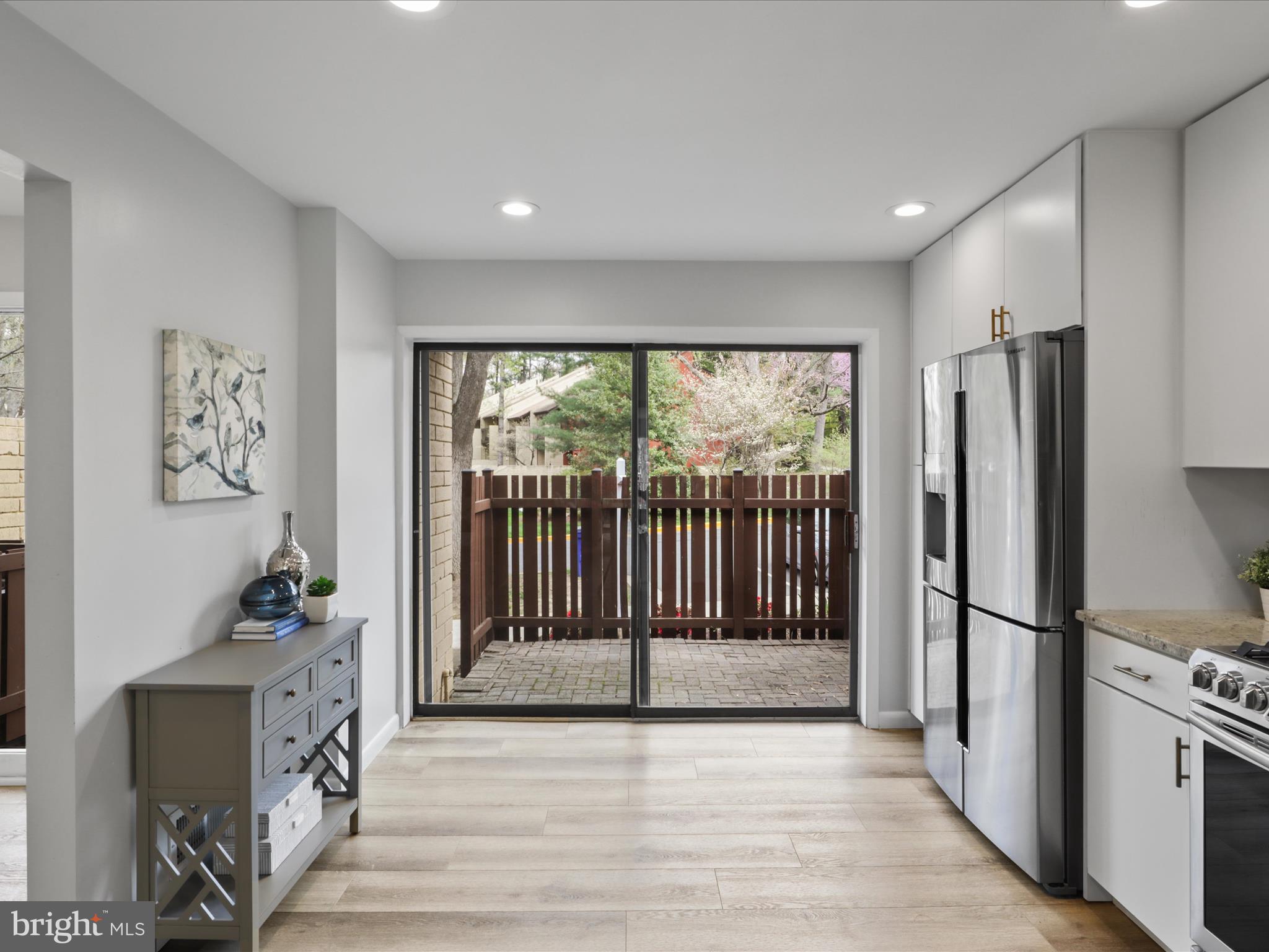11159 Saffold Way Reston, VA 20190 - Photo 5 of 51 a view of hallway with furniture and a fireplace