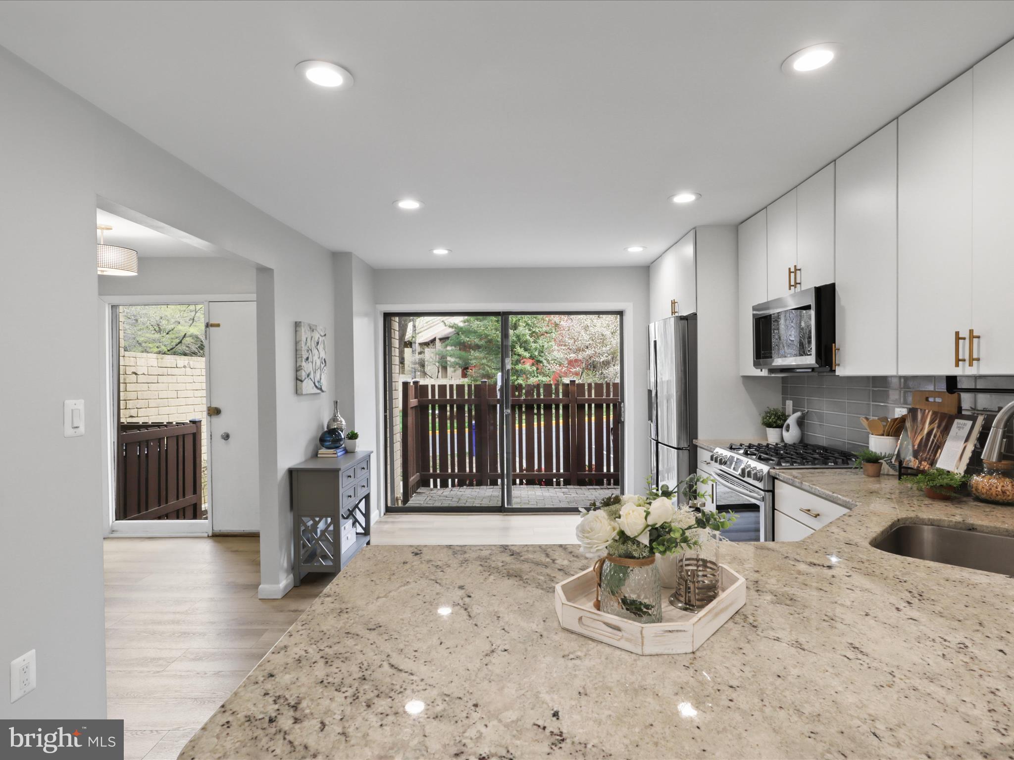 11159 Saffold Way Reston, VA 20190 - Photo 6 of 51 a room with furniture and a large window