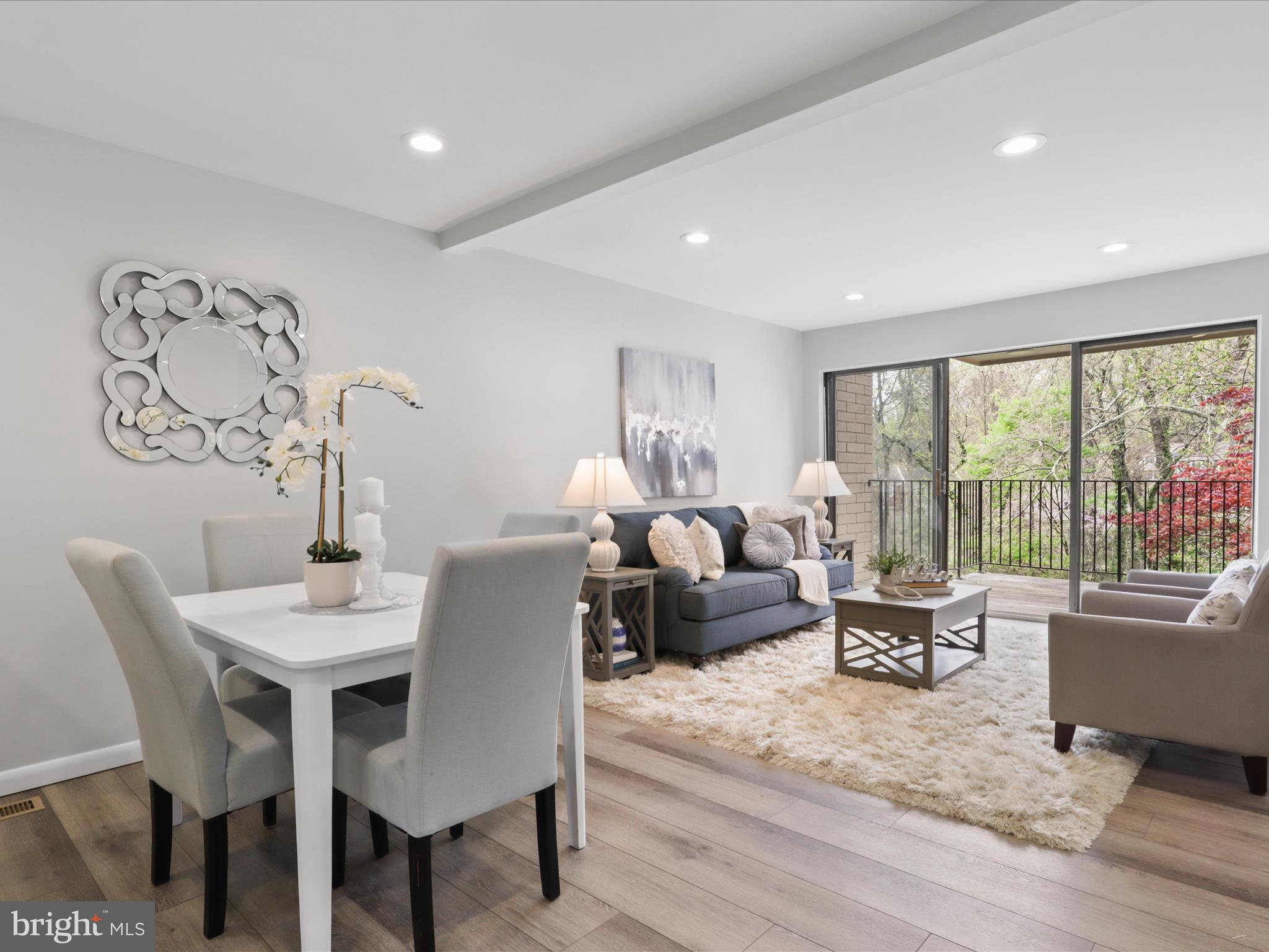 11159 Saffold Way Reston, VA 20190 - Photo 7 of 51 a living room with furniture and a large window