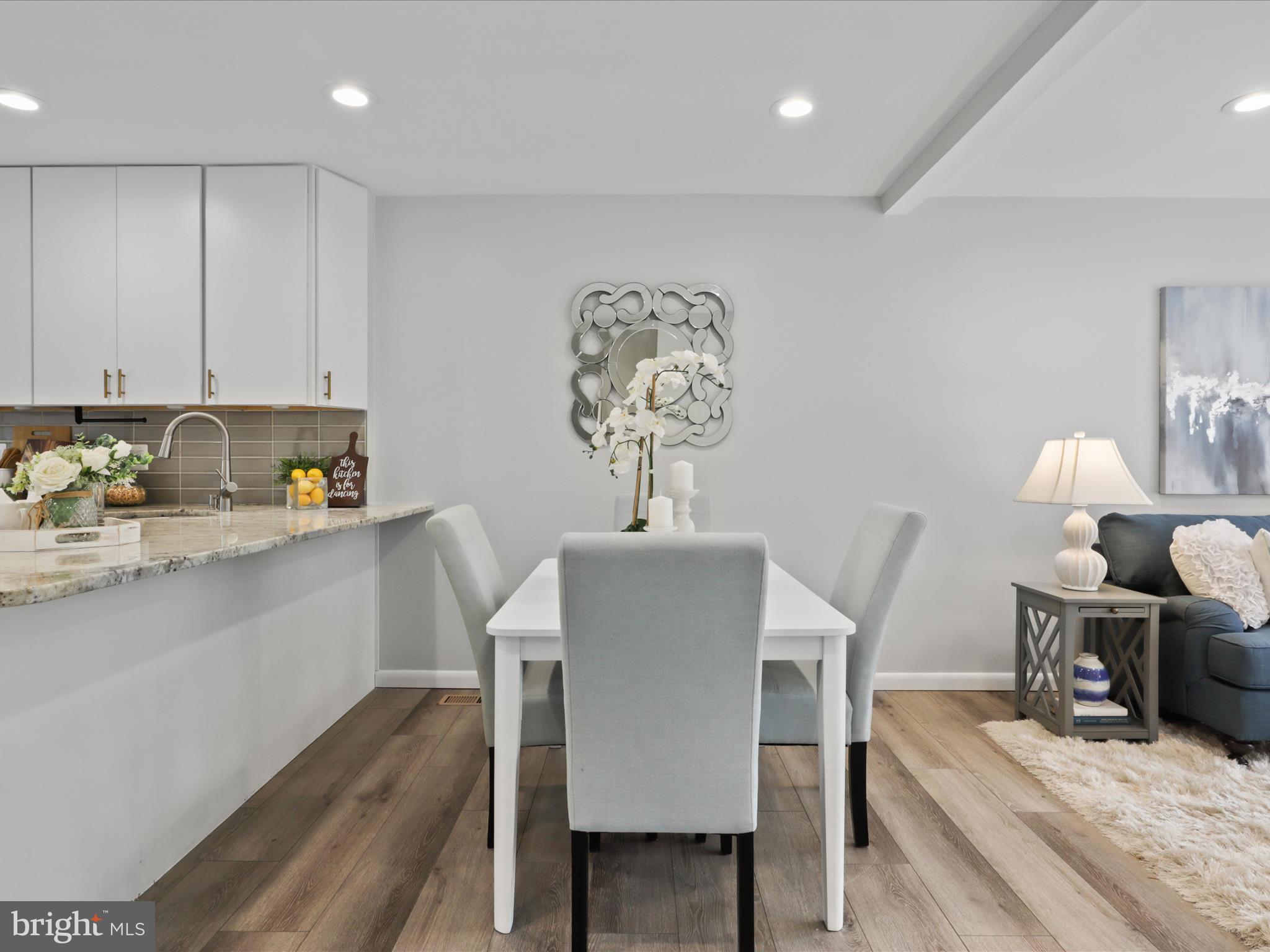 11159 Saffold Way Reston, VA 20190 - Photo 8 of 51 a view of a dining room with furniture