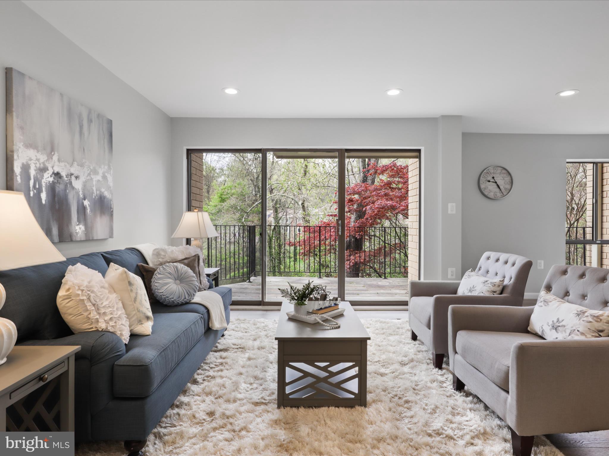 11159 Saffold Way Reston, VA 20190 - Photo 10 of 51 a living room with furniture and a large window