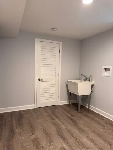 a view of a room that has a table and chair in it