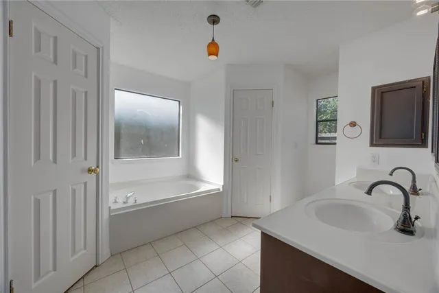 a bathroom with a sink and a bathtub