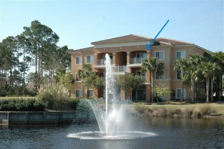625 Fairway Drive, Unit 302 St. Augustine, FL 32084 - Photo 19 of 22 a front view of a house with a yard