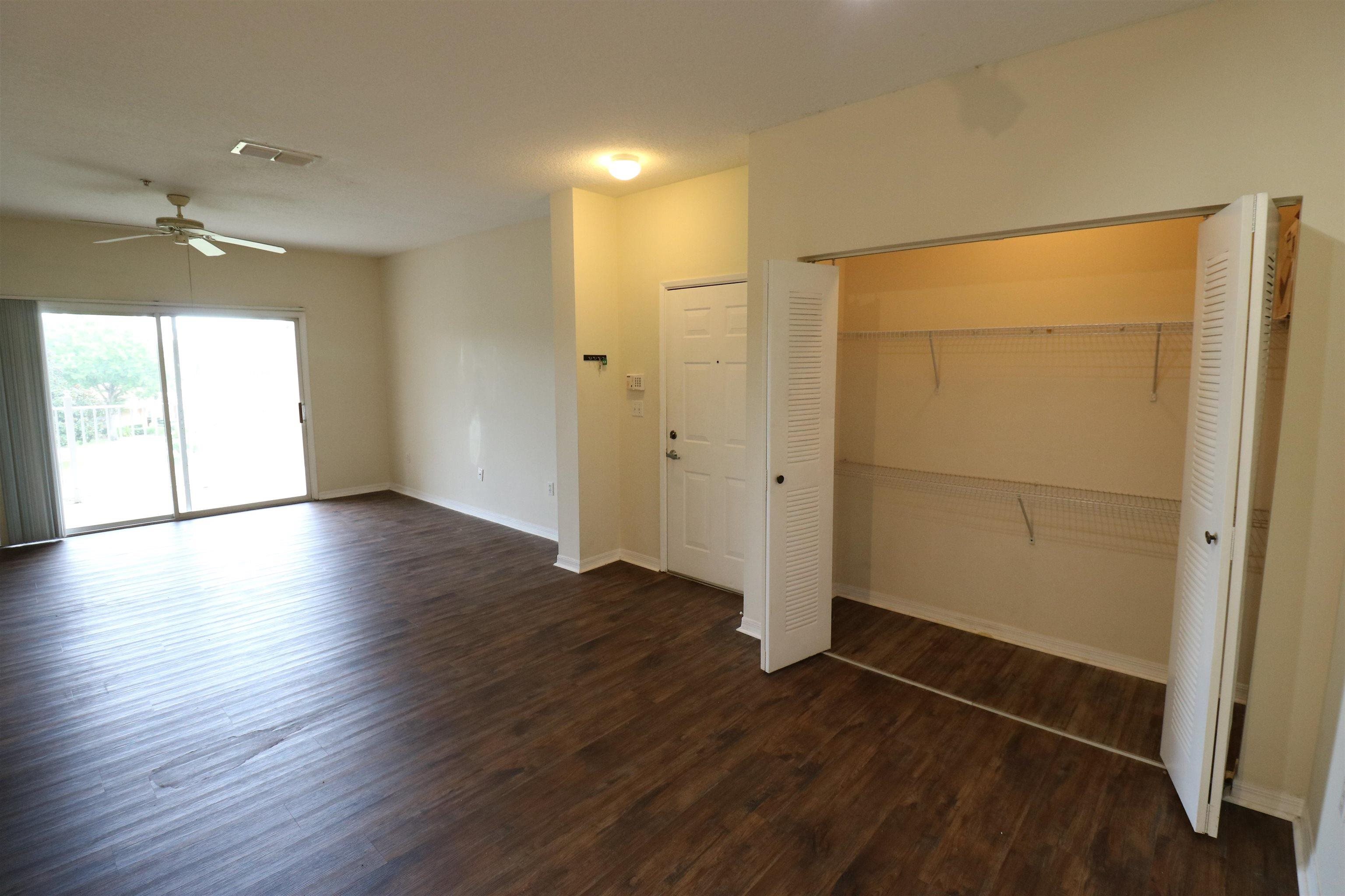 625 Fairway Drive, Unit 302 St. Augustine, FL 32084 - Photo 6 of 22 an empty room with wooden floor and a window