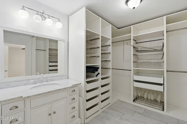 a bathroom with a shower sink and mirror