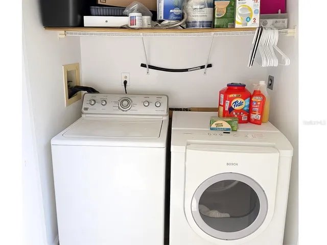 a utility room with dryer and washer