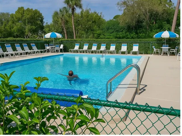 a view of a swimming pool with a patio