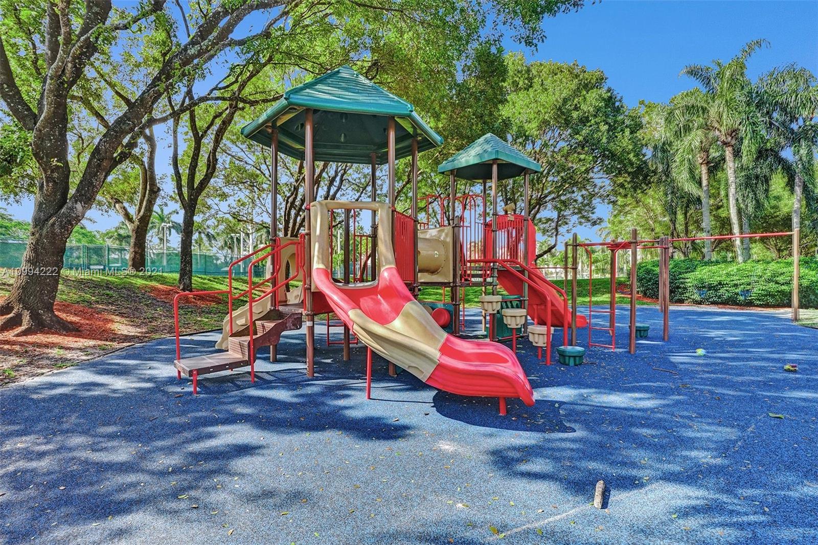 6761 Northwest 112th Avenue Doral, FL 33178 - Photo 54 of 55 a view of a park with slide and a bench