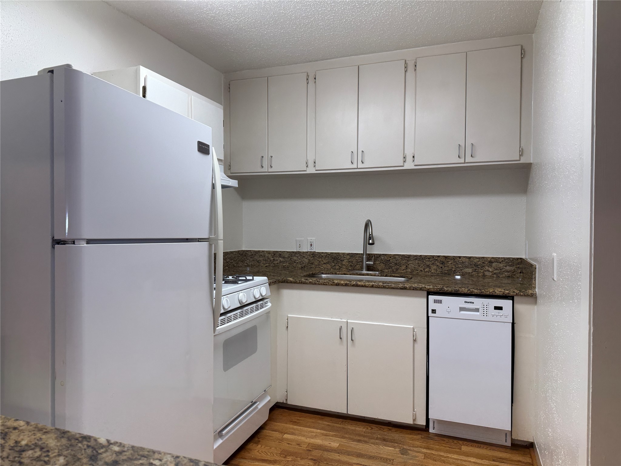 1801 Cortlandt Street, Unit 16 Houston, TX 77008 - Photo 14 of 35 a white refrigerator freezer sitting inside of a kitchen