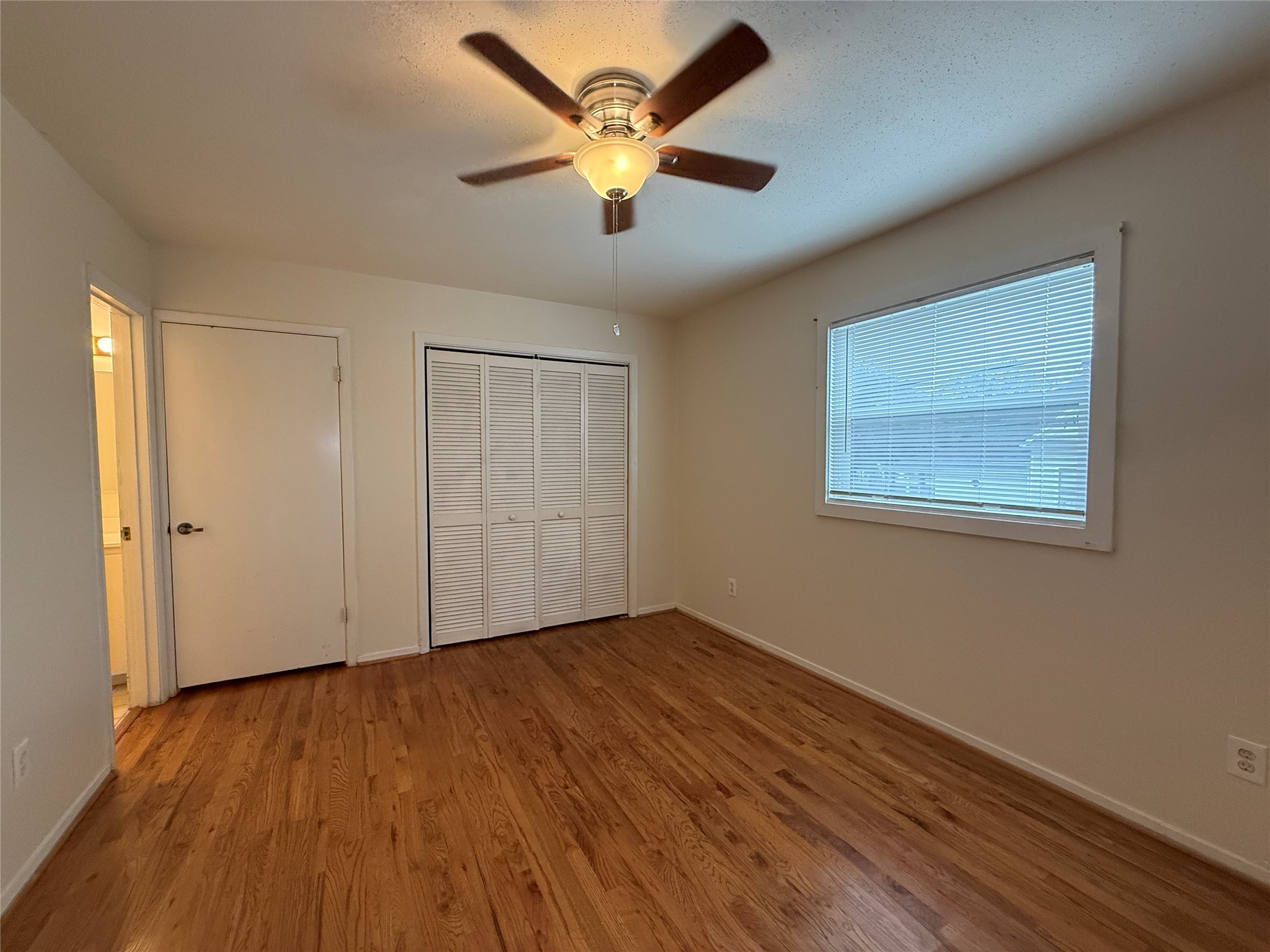 1801 Cortlandt Street, Unit 16 Houston, TX 77008 - Photo 16 of 35 a view of an empty room with window and wooden floor