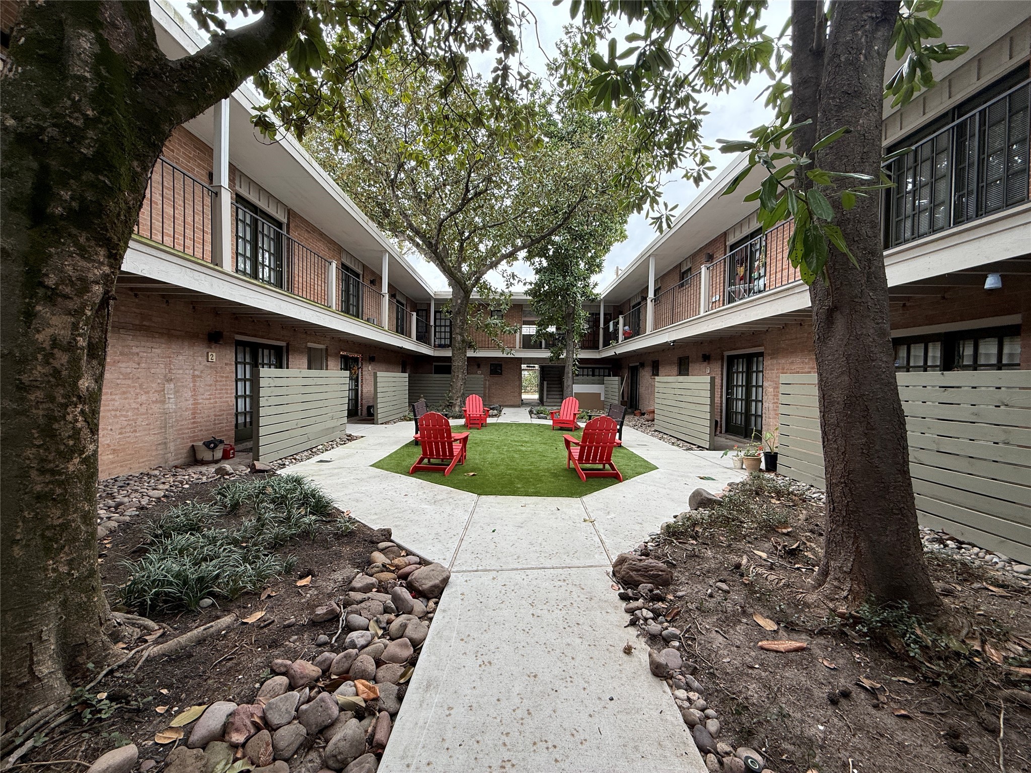 1801 Cortlandt Street, Unit 16 Houston, TX 77008 - Photo 2 of 35 a front view of a house with a yard and potted plants