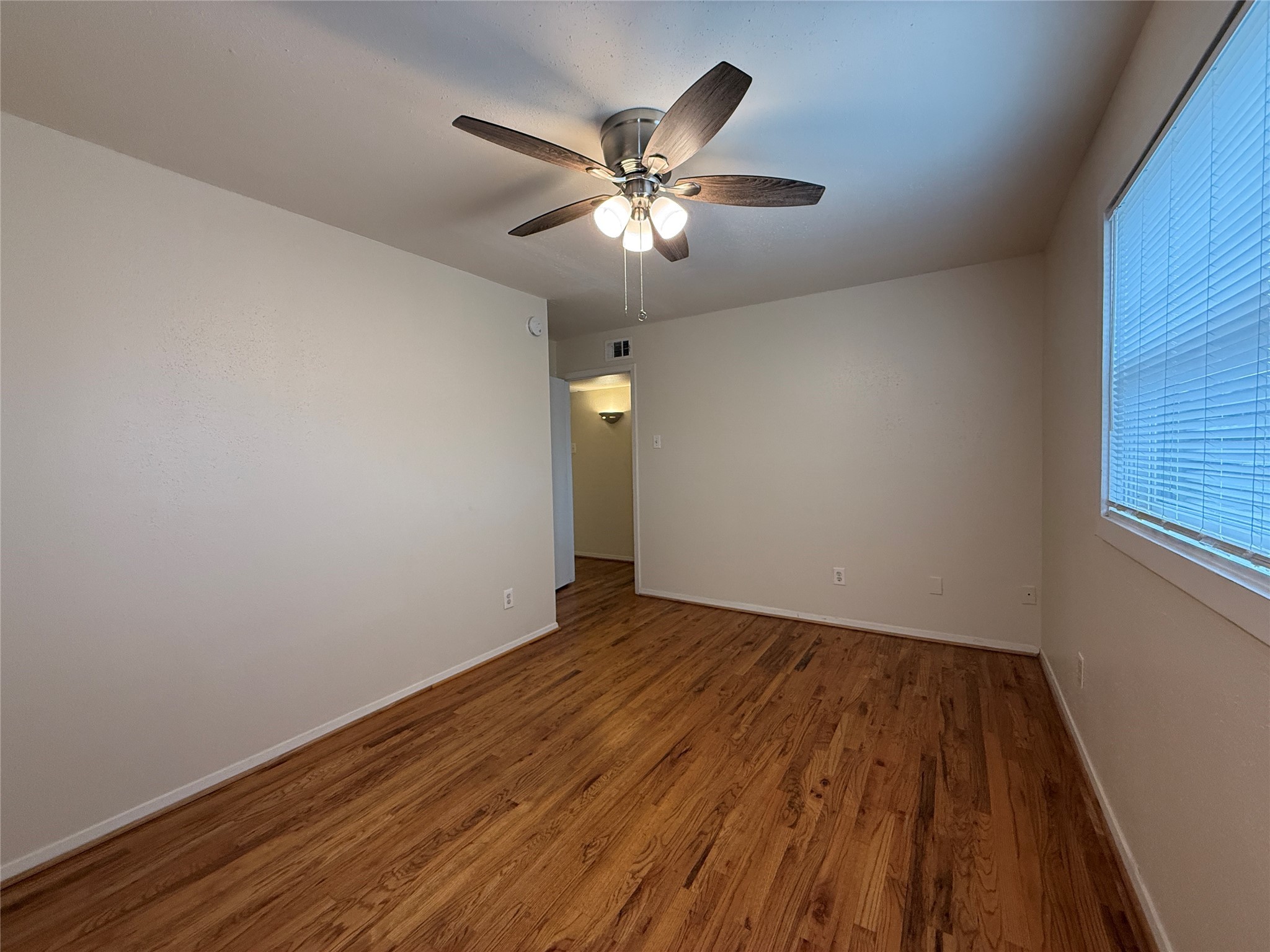 1801 Cortlandt Street, Unit 16 Houston, TX 77008 - Photo 26 of 35 wooden floor in an empty room with a window