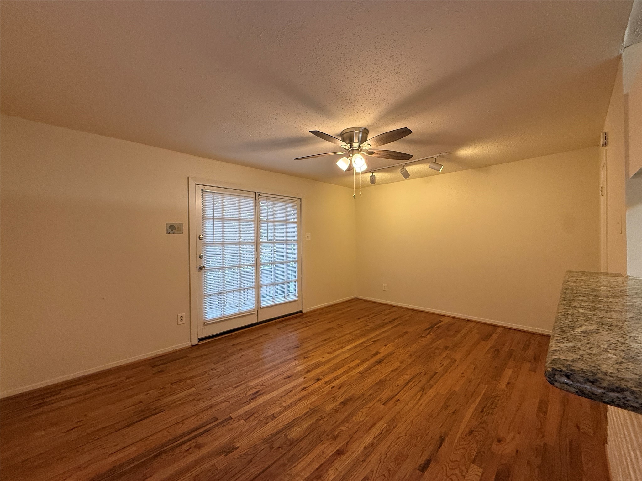 1801 Cortlandt Street, Unit 16 Houston, TX 77008 - Photo 9 of 35 a view of an empty room with wooden floor and a window