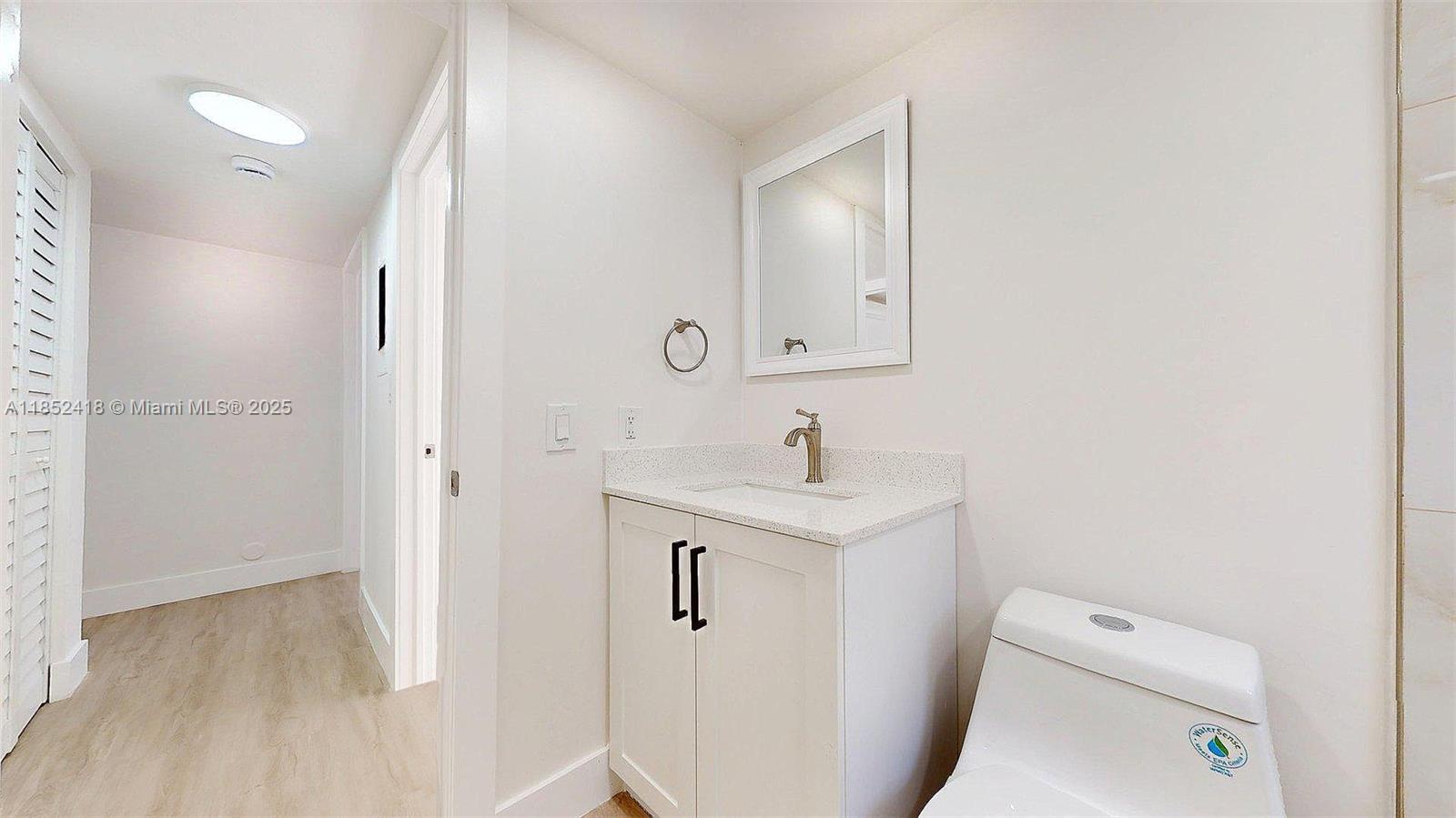 1674 West 42nd Street, Unit 1674 Hialeah, FL 33012 - Photo 17 of 29 a bathroom with a sink a toilet and shower