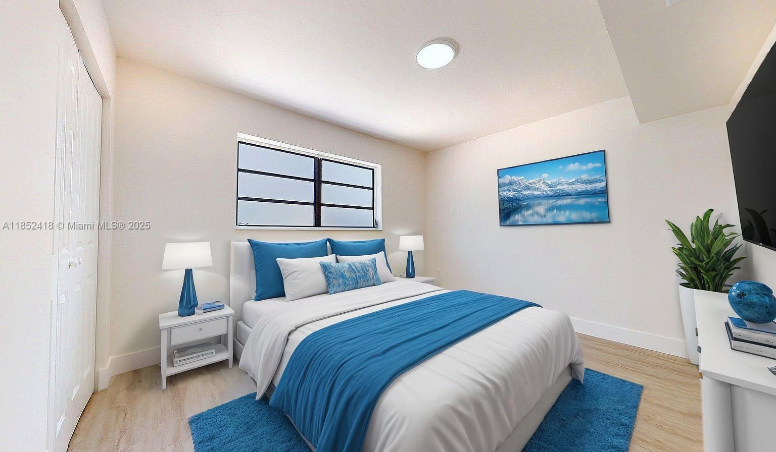 1674 West 42nd Street, Unit 1674 Hialeah, FL 33012 - Photo 20 of 29 a bedroom with a bed and a potted plant