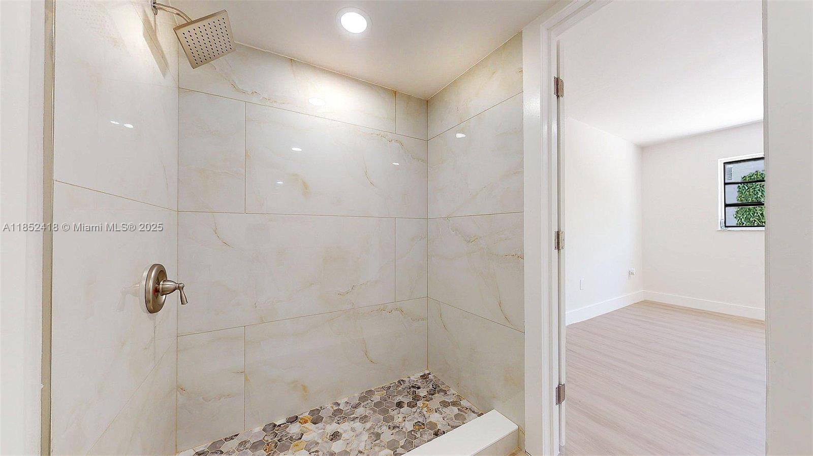 1674 West 42nd Street, Unit 1674 Hialeah, FL 33012 - Photo 23 of 29 a bathroom with a shower