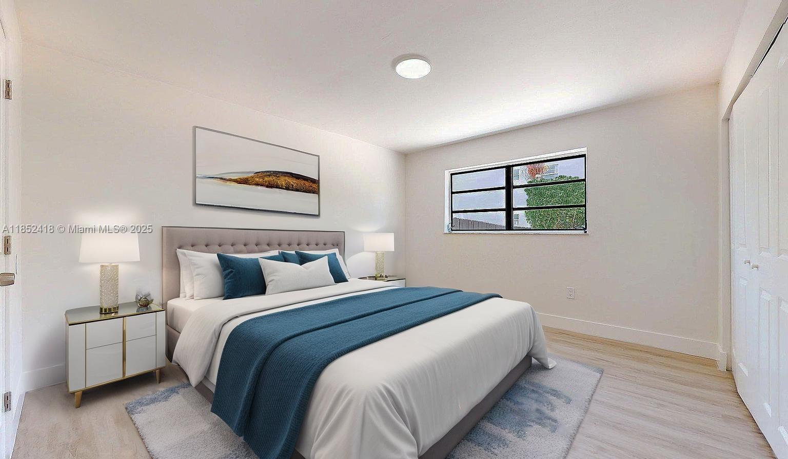 1674 West 42nd Street, Unit 1674 Hialeah, FL 33012 - Photo 26 of 29 a bedroom with bed and a night stand