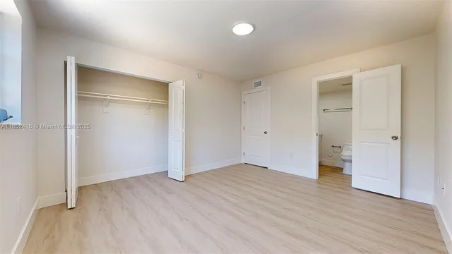 a pathway of a house with a yard