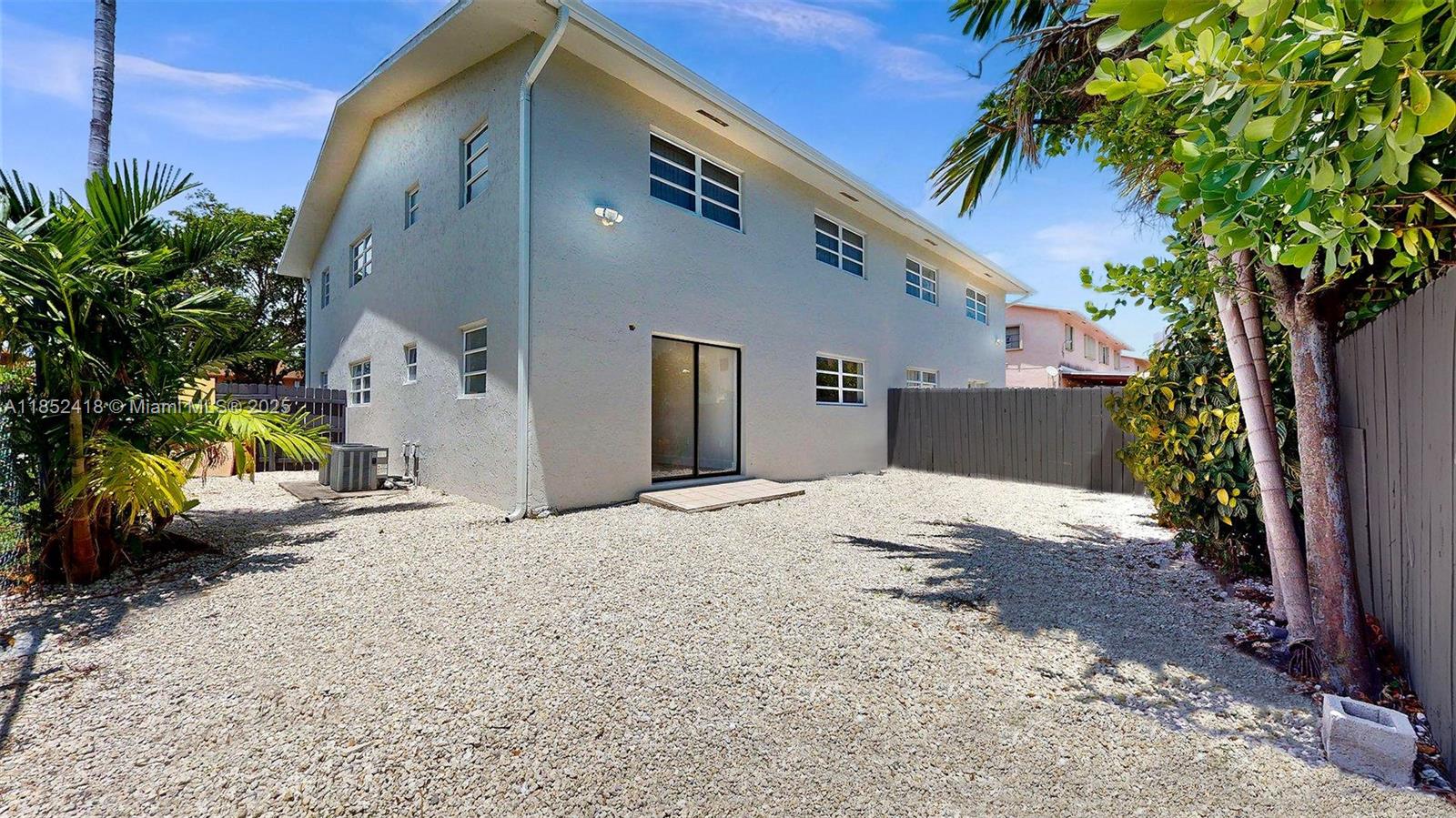 1674 West 42nd Street, Unit 1674 Hialeah, FL 33012 - Photo 28 of 29 a pathway of a house with a yard