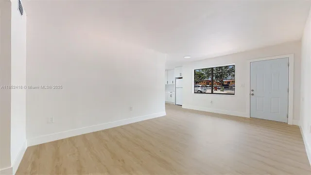 an empty room with a bench