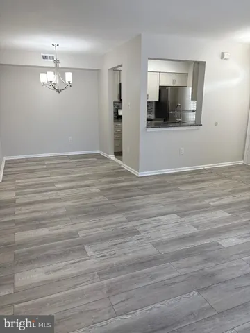a view of a livingroom with wooden floor