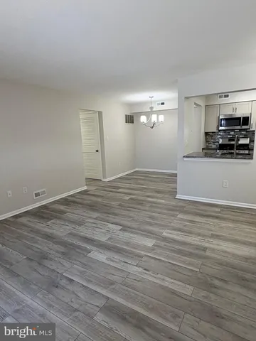 a view of a livingroom with wooden floor