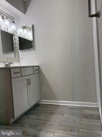 a view of cabinets and wooden floor